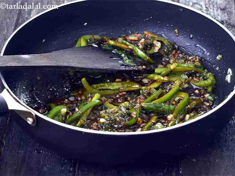 Step 20 – Now season it with sugar and salt, mix well and cook on a medium flame …