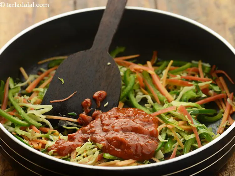 Step 12 – Add schezuan sauce as per the spice level you prefer.