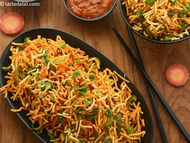 Step 19 – Remove in a serving plate and garnish&nbsp;<b><span style="font-size: 12pt; font-family: Cambria;">| Indian style Chinese bhel …