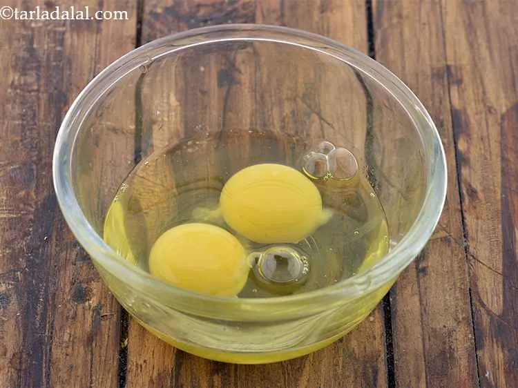 Step 14 – In a deep bowl, break two eggs. If you want, you can increase the quantity …