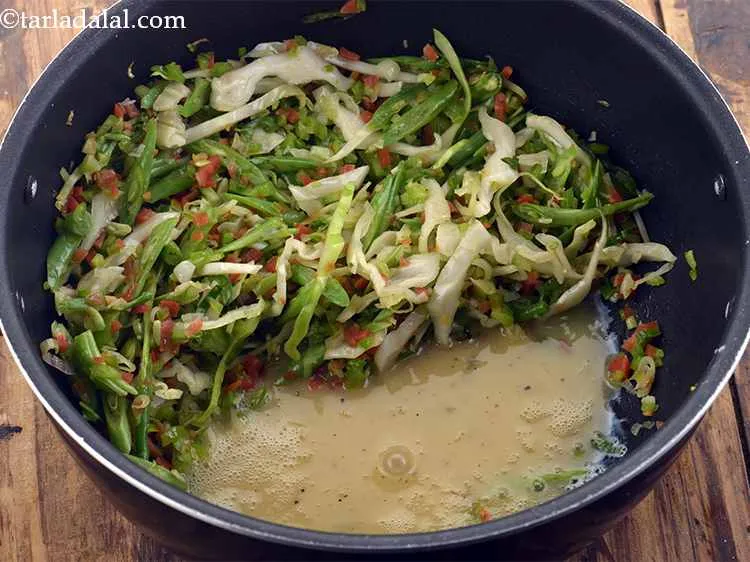 Step 26 – Pour the whisked eggs in the pan.