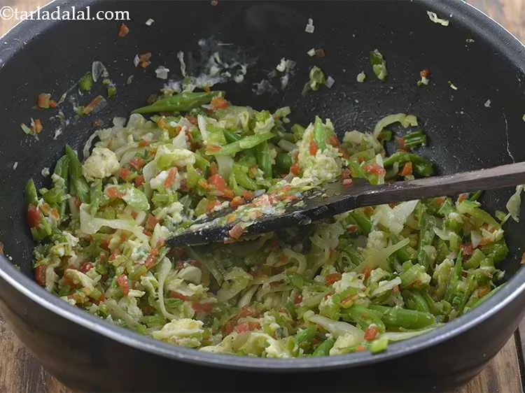 Step 28 – Mix together the eggs and vegetables.