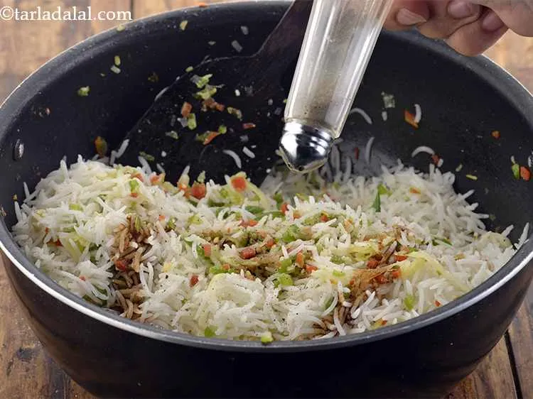 Step 30 – Add the soya sauce and salt, mix the <strong>Chinese Egg Fried Rice</strong> well and cook …