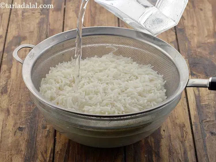 Step 10 – Pour some cold water on the rice to stop further cooking.&nbsp;Let all the water from …