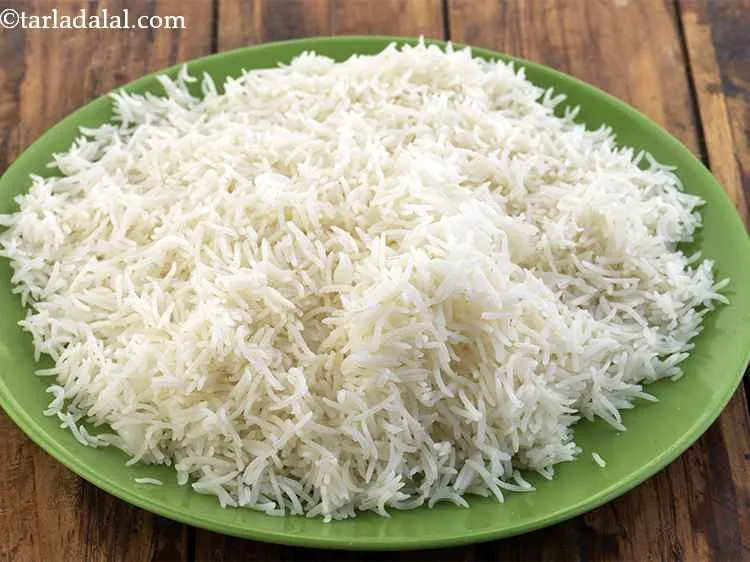 Step 13 – Spread the cooked rice on a flat surface or a big plate and allow it …