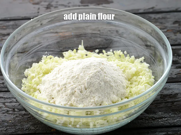 Step 4 – Add 1/2 cup&nbsp;<a href="https://www.tarladalal.com/glossary-plain-flour-maida-188i">plain flour (maida)</a>.&nbsp;