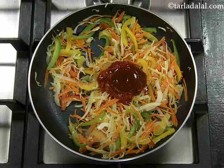 Step 6 – Now add the tomato ketchup. Also, you can use tamarind chutney or sweet chilli sauce.