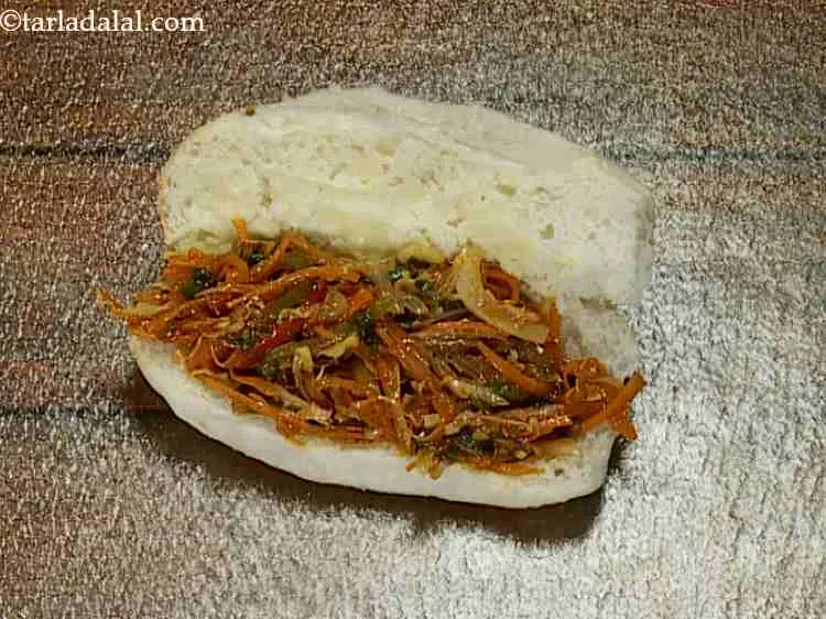 Step 14 – On the lower halve of the hot dog roll put a portion of the Chinese …