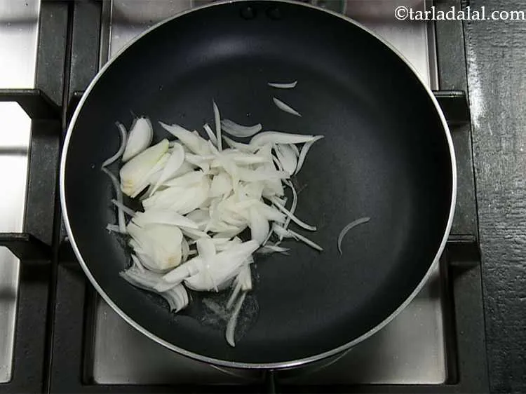 Step 1 – Heat the oil in a broad non-stick pan, add the spring onion whites.