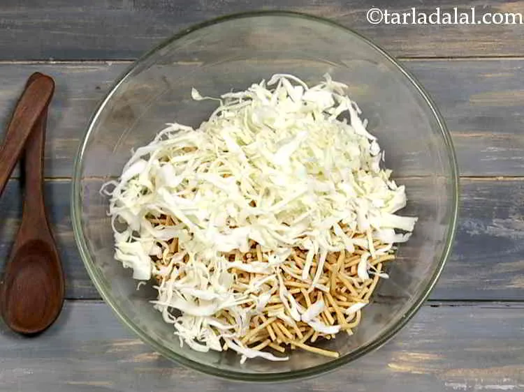 Step 8 – Now add shredded cabbage to it. You can shred it in a food processor or …