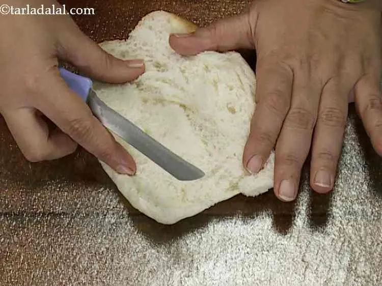 Step 12 – Slit the hot dog roll horizontally using a sharp knife.