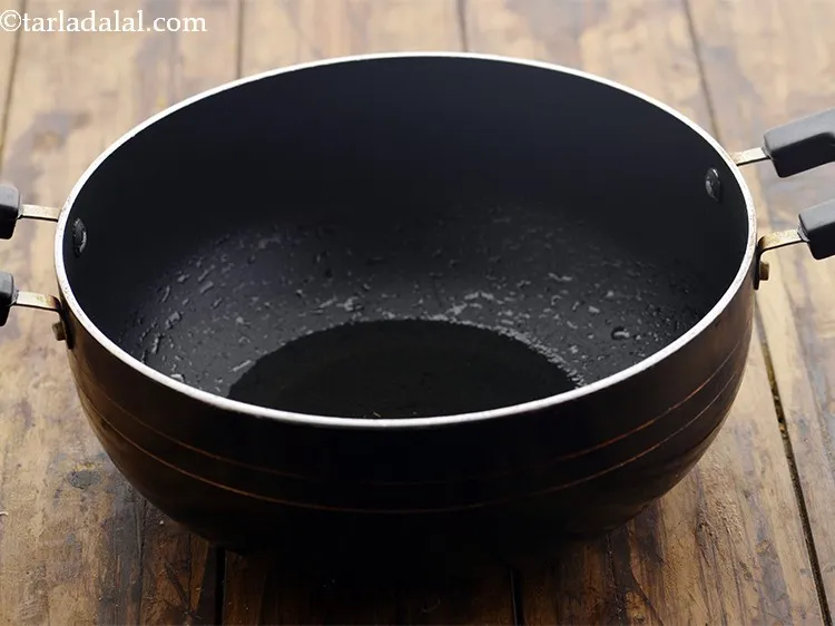 Step 9 – To prepare the <strong>South-Indian Chitranna rice</strong>, heat the oil in a deep non-stick pan. For …