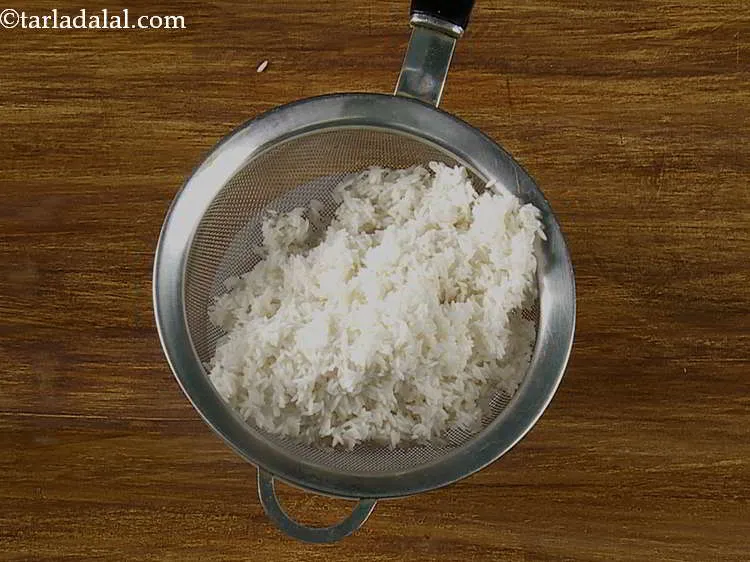 Step 2 – After half an hour, drain the rice using a strainer.