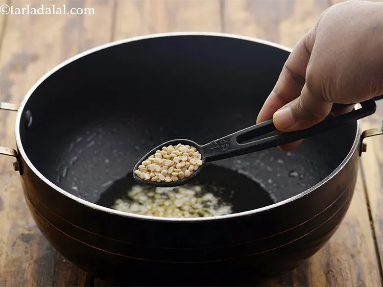 Step 11 – Add urad dal.