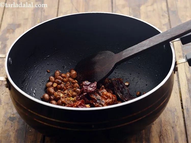Step 15 – Add the curry leaves and dry red chillies.
