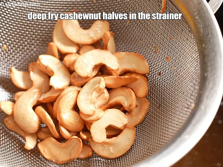 Step 16 – Repeat the strainer method of step 1 to deep fry 1/4 cup&nbsp;<a href="https://www.tarladalal.com/glossary-cashew-nut-halves-2511i">cashewnut (kaju) halves</a>.