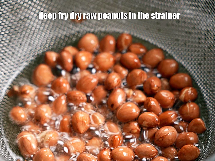 Step 10 – <strong>To deep fry nuts and dal</strong>, in the same strainer, deep fry 1/4 cup&nbsp;<a href="https://www.tarladalal.com/glossary-raw-peanuts-kachi-mungfali-kachi-moongfali-847i">raw …