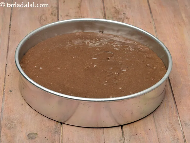 Step 51 – Pour the batter into a greased 250 mm. (10&rdquo;) diameter tin.
