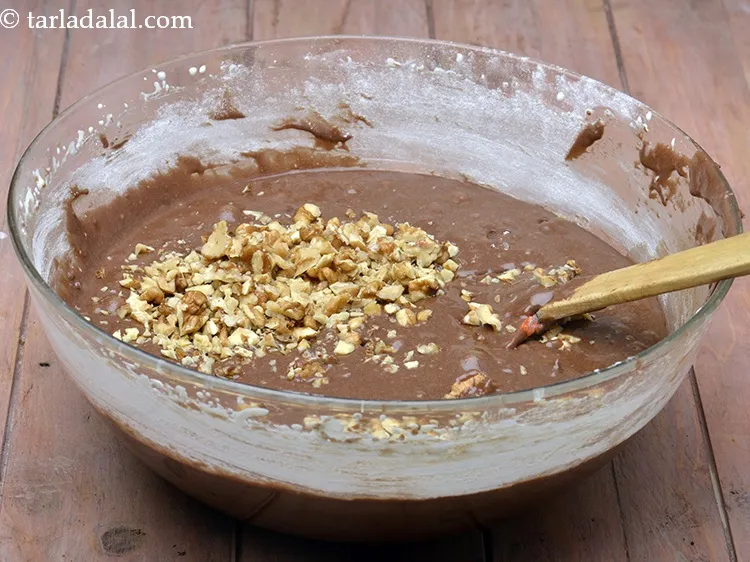 Step 48 – Add 1/2 cup&nbsp;<a href="https://www.tarladalal.com/glossary-chopped-walnuts-785i">chopped walnuts (akhrot)</a>.
