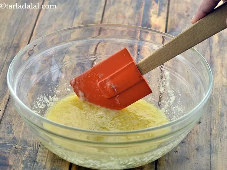 Step 11 – <div> Mix well with the help of a spatula.</div>