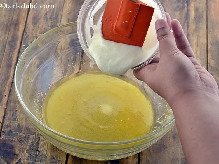 Step 13 – Now combine the curds-soda with the butter-sugar mixture.