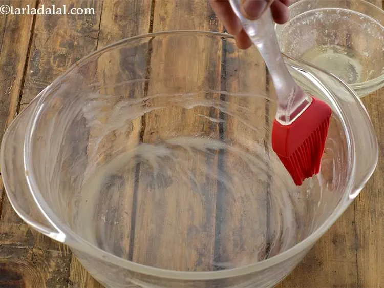 Step 19 – Now take a 150 mm (6&rdquo;) diameter shallow microwave safe dish and grease it properly …