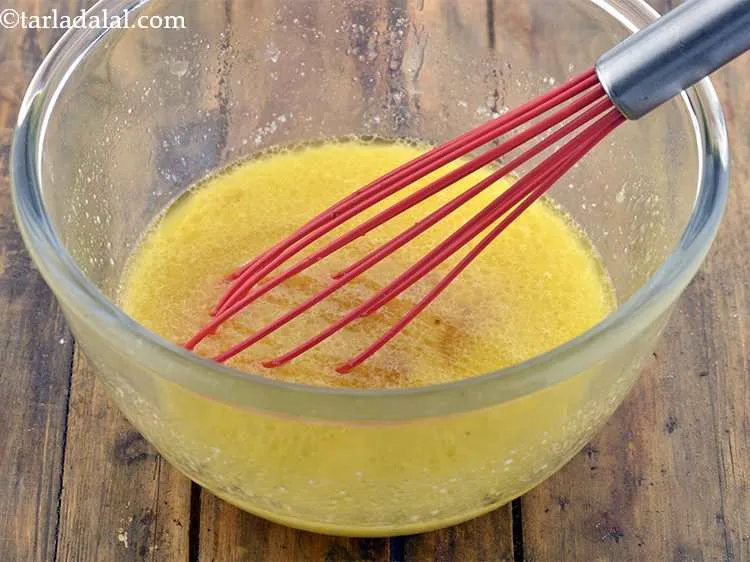 Step 5 – Add &frac14; cup of hot water and whisk well till the sugar dissolves.