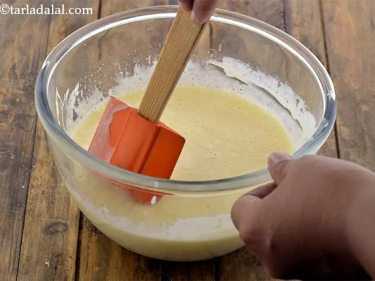 Step 6 – Add the curd mixture to the butter- sugar mixture and mix well with the help …