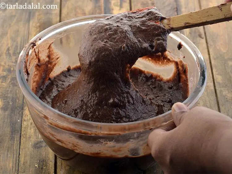 Step 8 – Now add the other half of the flour-cocoa mixture and mix well until no lumps …