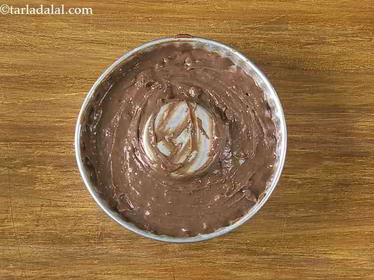 Step 20 – Bake at 180 &deg; C for 40-45 minutes. The&nbsp;<strong>Eggless</strong>&nbsp;<strong>Chocolate Fudge Cake</strong>&nbsp;is ready when it leaves …