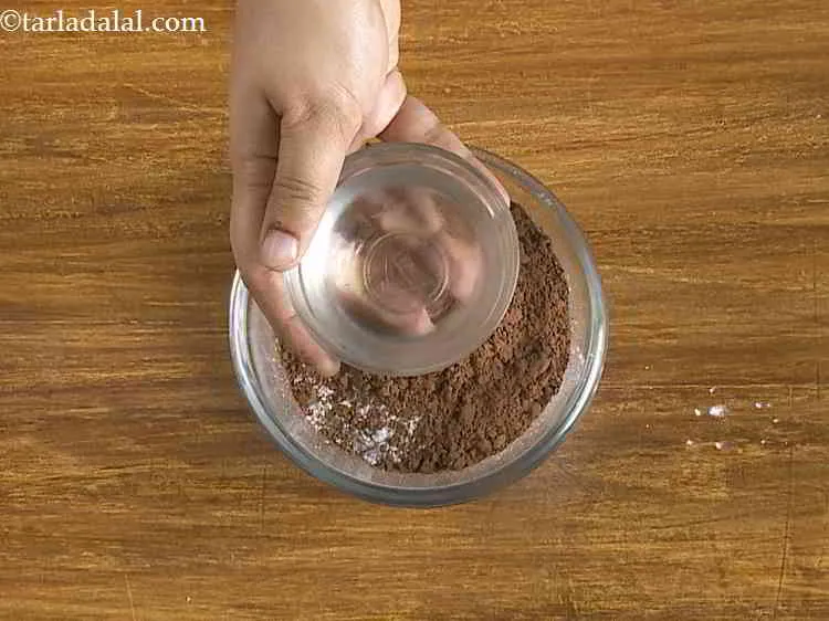 Step 24 – Add not more than 3 to 4 tbsp of water into the bowl.