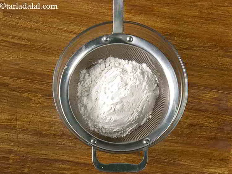Step 9 – Put the plain flour into the bowl with sieve.
