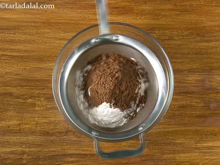 Step 10 – Also, put the cocoa powder.
