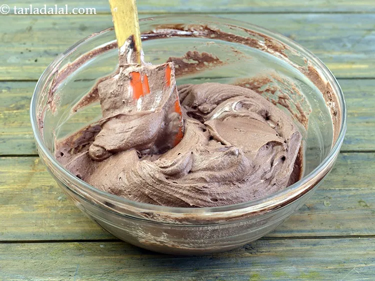 Step 27 – Add the prepared chocolate-milk mixture to this whipped cream mixture and fold gently. The filling …