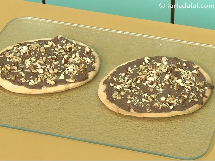 Step 28 – Place both pizzas on a baking tray and bake in a pre-heated oven at 180&deg;C …