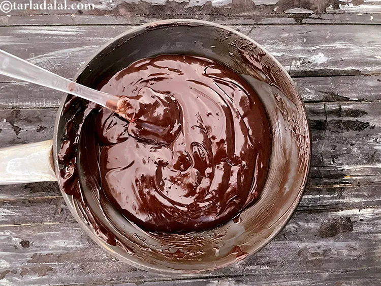 Step 19 – <strong>Here is image two&nbsp;of dark chocolate melting while stirring with a spatula.</strong>