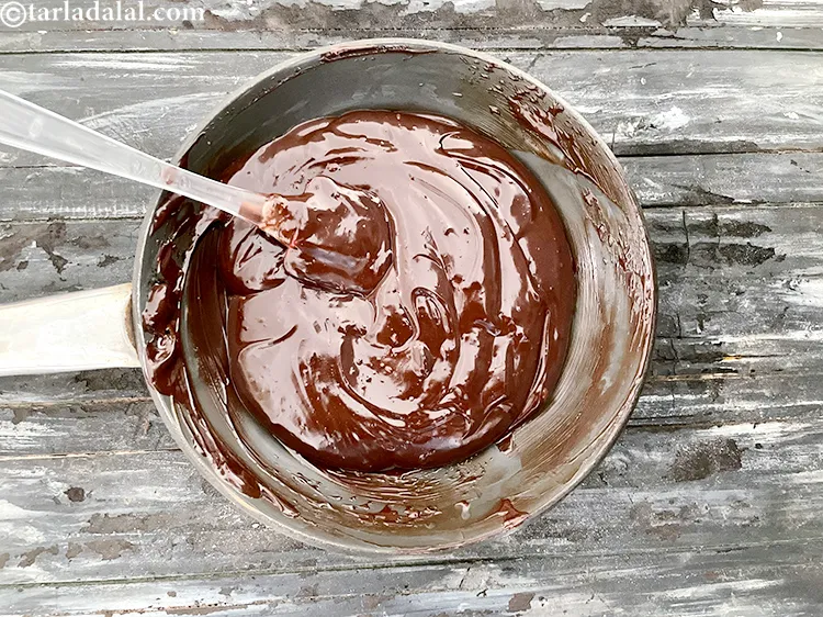 Step 20 – <strong>Here is image three of dark chocolate melting while stirring with a spatula.</strong>