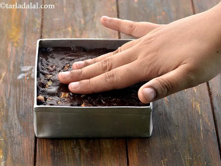 Step 12 – Pat the mixture lightly with your hands to smoothen the surface further.