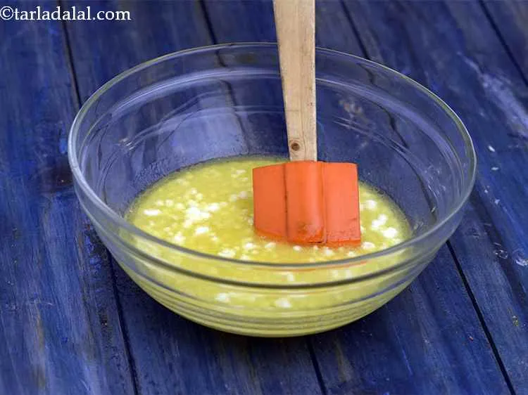 Step 6 – Add the curds-soda mixture and mix well.