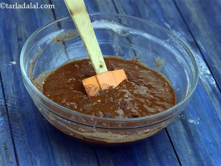 Step 7 – Add the flour mixture and 1/8 cup of walnuts and mix gently to make a …