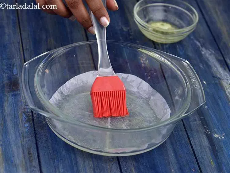 Step 8 – Grease a shallow microwave safe dish using butter. Line it with a piece of greaseproof …