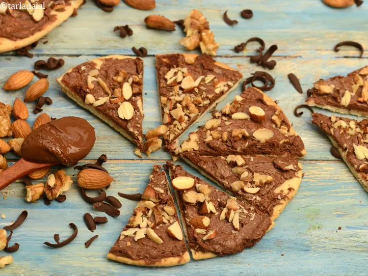Step 29 – Cut <strong>chocolate pizza&nbsp;</strong>into equal wedges and serve immediately.