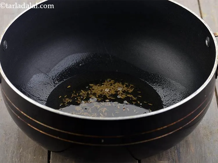 Step 14 – For the&nbsp;<strong>Punjabi chole masala gravy</strong>, heat the oil in a deep non-stick pan and add …