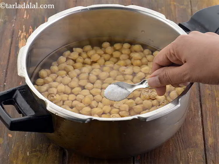Step 4 – Combine the kabuli chana, soda bi- carb and salt in a pressure cooker