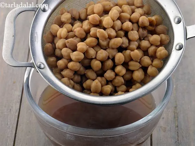 Step 13 – Drain the kabuli chana well using a strainer. You can reserve the water and use …
