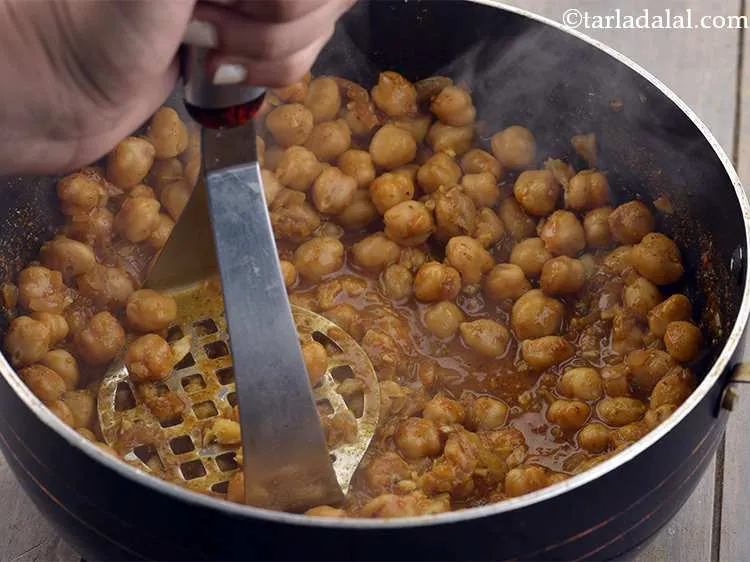 Step 29 – Mash the kabuli chana once lightly using a masher, do not over mash it. This …