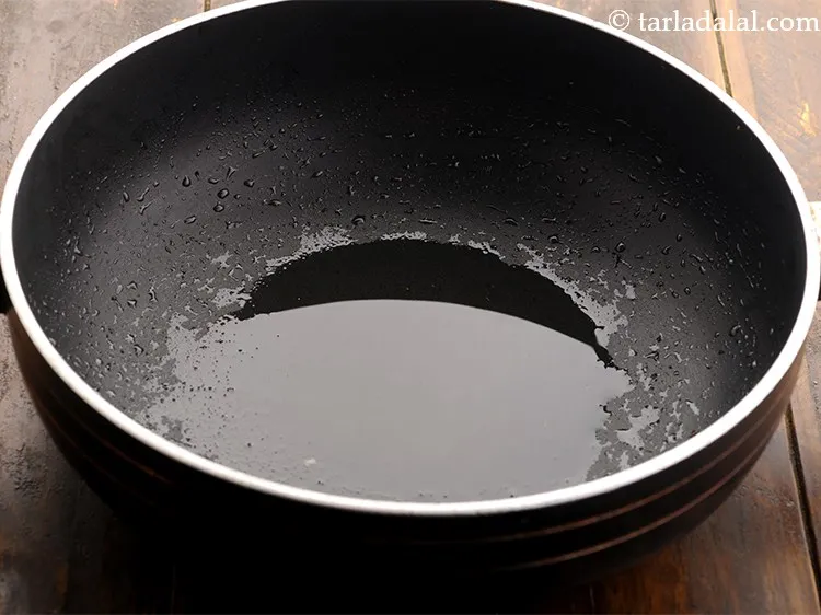 Step 8 – Further, heat 2 tsp of oil in a deep pan.