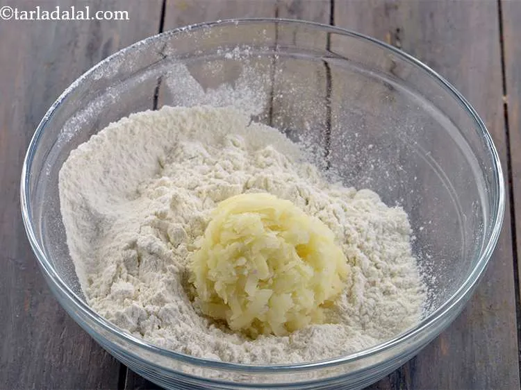 Step 2 – Add the potatoes. This is added to give softness to the dough. Do not mash …