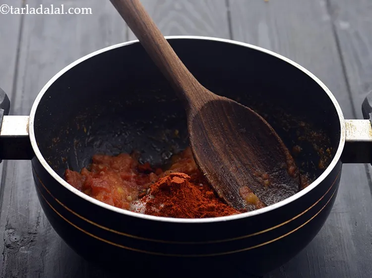 Step 19 – Add the black salt. Add the chilli powder.