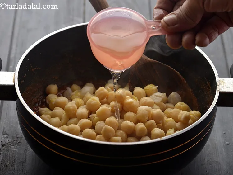 Step 23 – Add the chickpeas and &frac14; cup water.